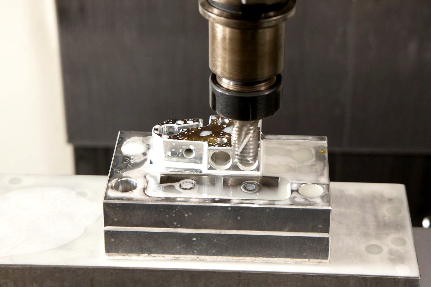End mill working a clamped billet
